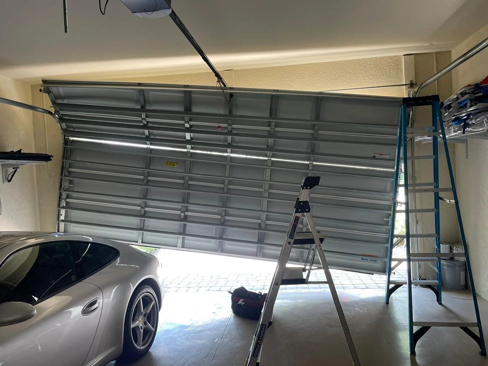 Off-track garage door repair — Pinnacle realigns and restores garage doors in Milton